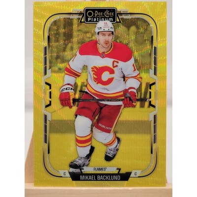 2025 Upper Deck O-Pee-Chee Platinum Mikael Backlund Neon Yellow Surge trading card, front